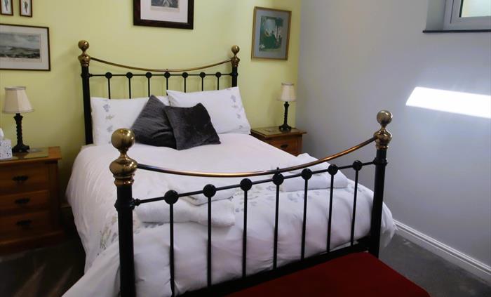 Next to shower room. Hair Dryer. Quality Bedlinen, Pillow protectors, Mattress Protectors used throughout cottage bedroom and changed frequently.